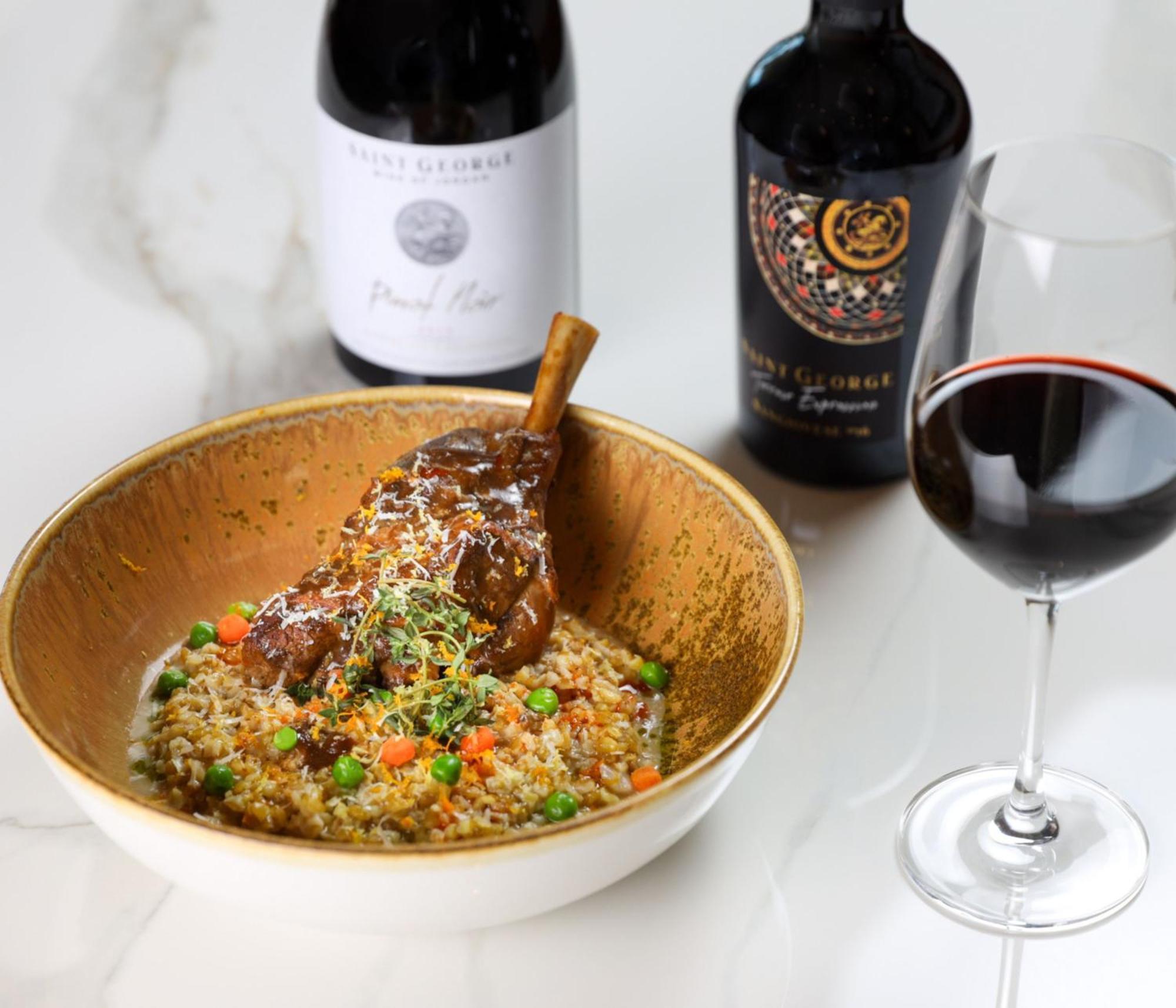 Crowne Plaza Jordan Dead Sea Resort & Spa By Ihg Sweimeh Buitenkant foto A lamb leg confit served with a glass of red wine